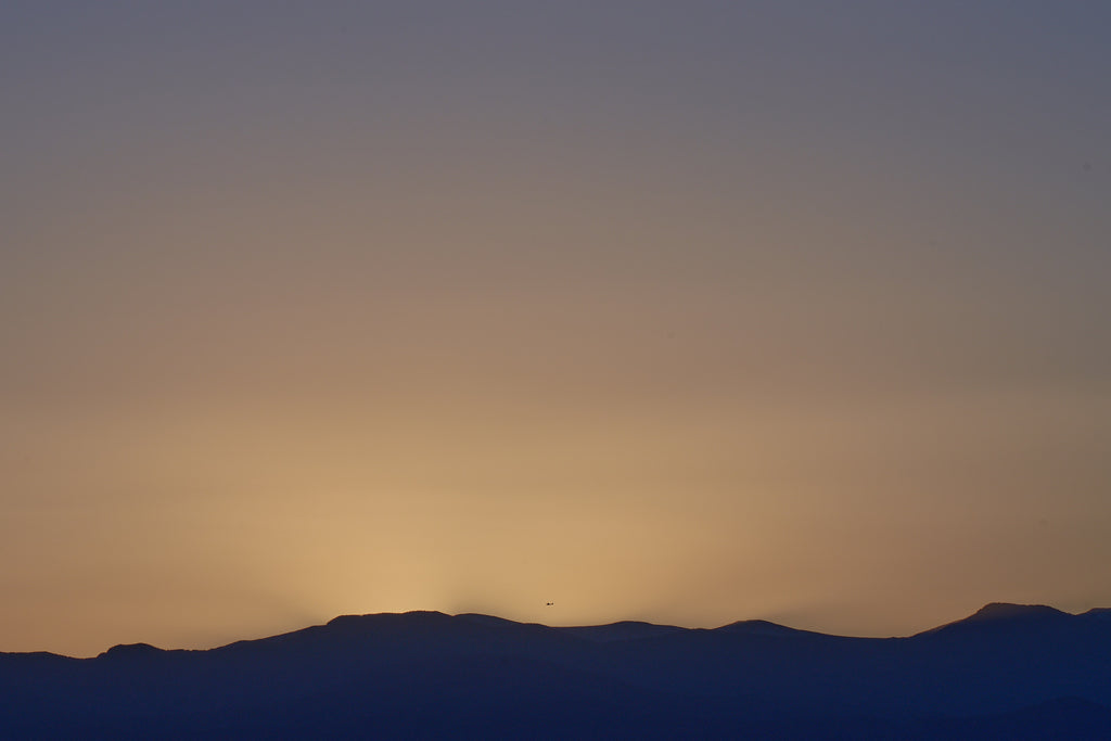 Solaris Crossing - Dramatic Mountain Sunset by Manuel Villa. Fine Art Landscape Photography on Acrylic, Metal, or Paper.